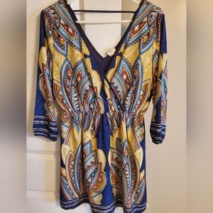 Patterned mini boutique v-neck dress. Size medium. Never worn.